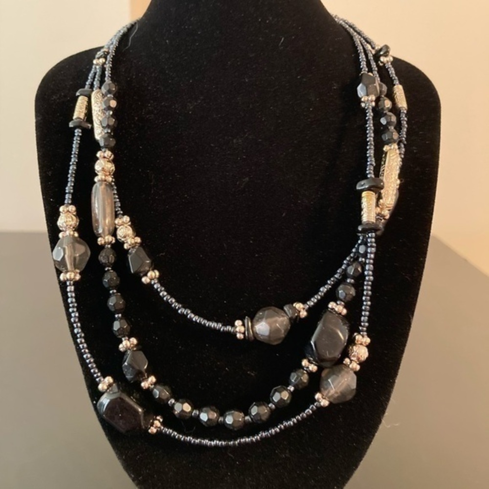Black and gold beaded necklace very long can be doubled up.